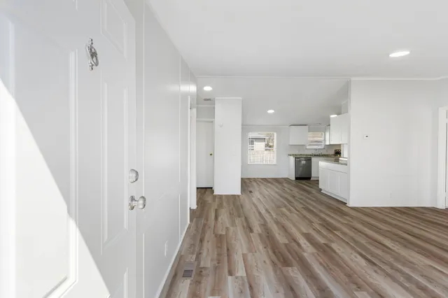 a view of kitchen and wooden floor