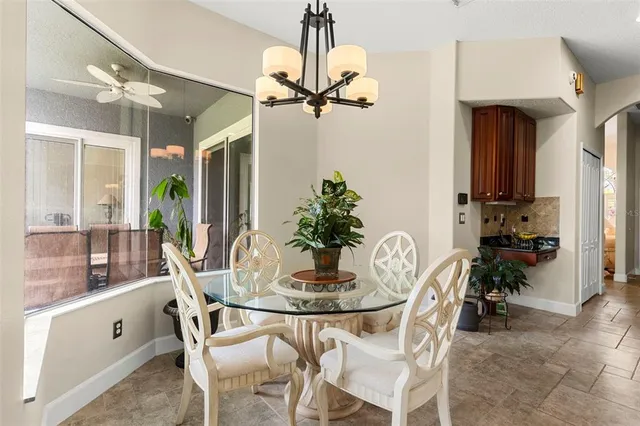 a dining room with furniture and window