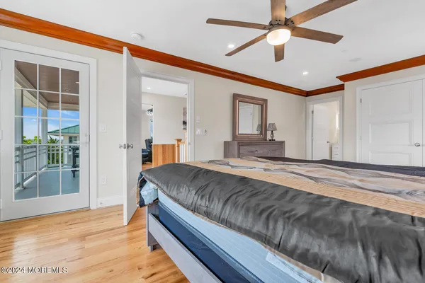 a bedroom with a bed and dresser
