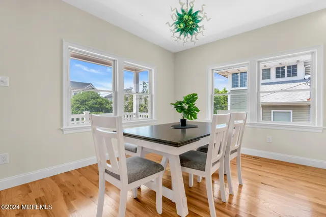 a bedroom with two beds and a table