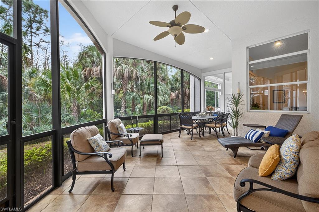 28540 Calabria Court, Unit 101 Naples, FL 34110 - Photo 25 of 41 Sunroom / solarium featuring lofted ceiling and a textured wall