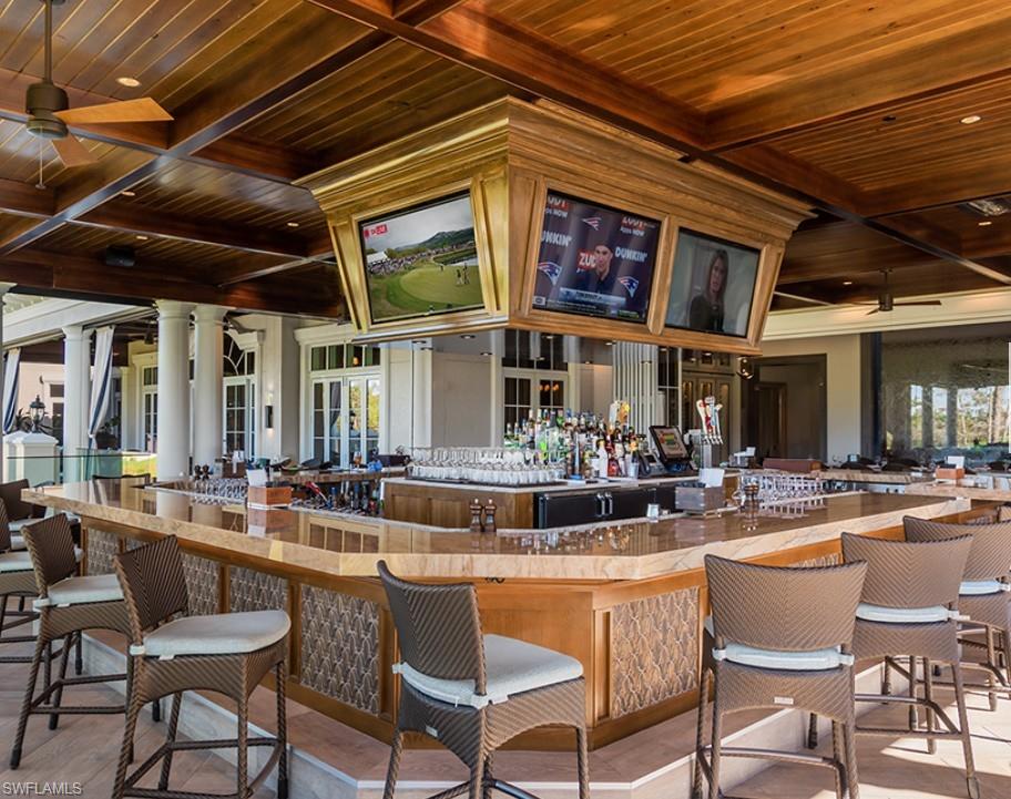 28540 Calabria Court, Unit 101 Naples, FL 34110 - Photo 36 of 41 Bar area with a wooden ceiling with exposed beams, coffered ceiling, recessed lighting, and glass insert cabinets