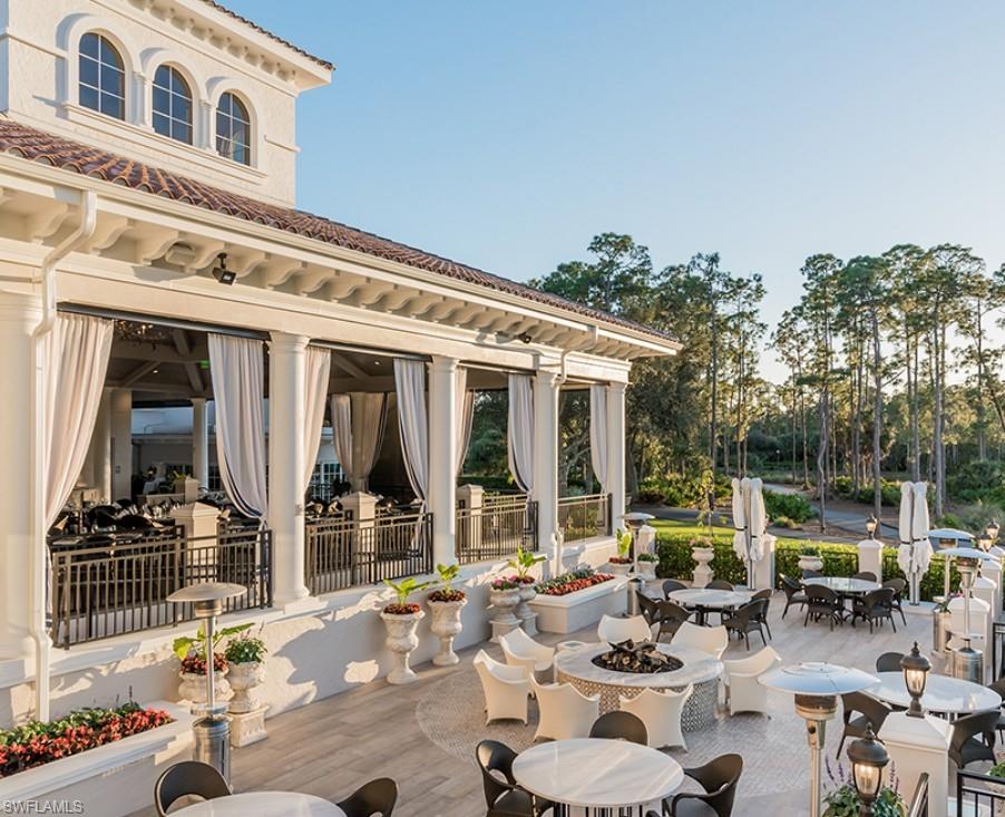 28540 Calabria Court, Unit 101 Naples, FL 34110 - Photo 37 of 41 View of patio featuring outdoor dining space and a fire pit