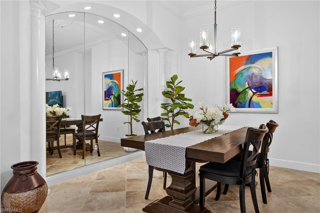 28540 Calabria Court, Unit 101 Naples, FL 34110 - Photo 7 of 41 Dining space with a chandelier, ornamental molding, and recessed lighting