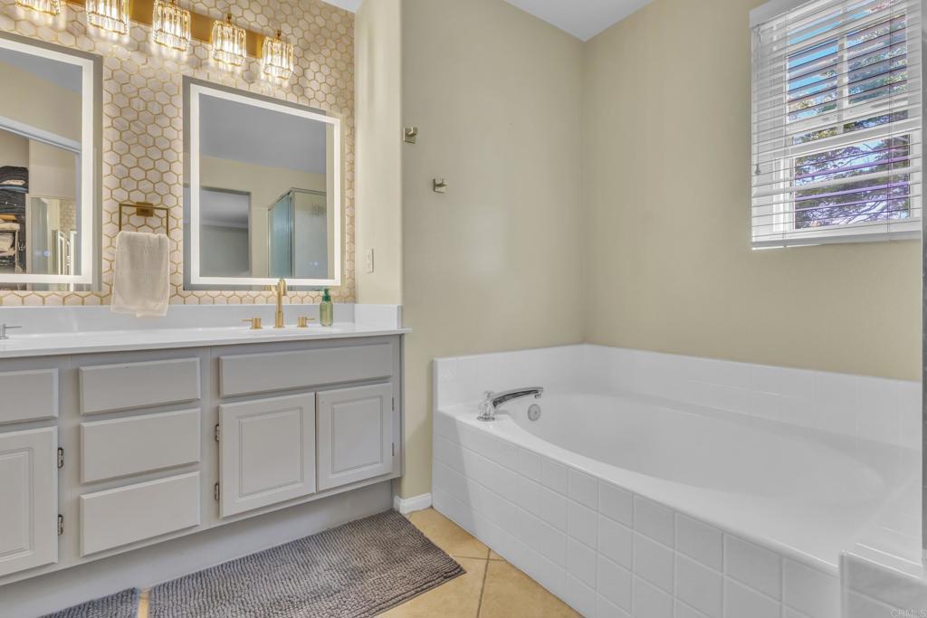 1306 Mill Valley Road Chula Vista, CA 91913 - Photo 23 of 43 a white bath tub sitting next to a bathroom sink