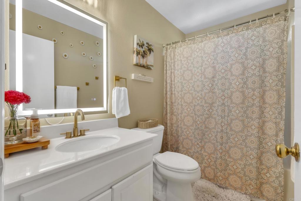 1306 Mill Valley Road Chula Vista, CA 91913 - Photo 25 of 43 a bathroom with a sink and a mirror