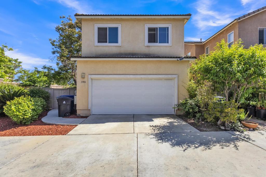 1306 Mill Valley Road Chula Vista, CA 91913 - Photo 33 of 43 a front view of a house with a garden
