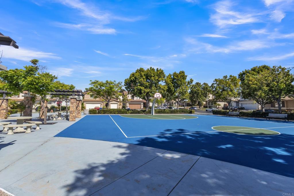 1306 Mill Valley Road Chula Vista, CA 91913 - Photo 36 of 43 a view of swimming pool with outdoor seating and trees in the background