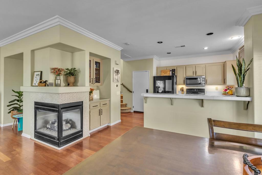 1306 Mill Valley Road Chula Vista, CA 91913 - Photo 5 of 43 a kitchen with stainless steel appliances granite countertop a stove a sink and a refrigerator