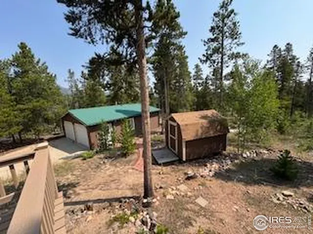 a backyard of a house with outdoor seating