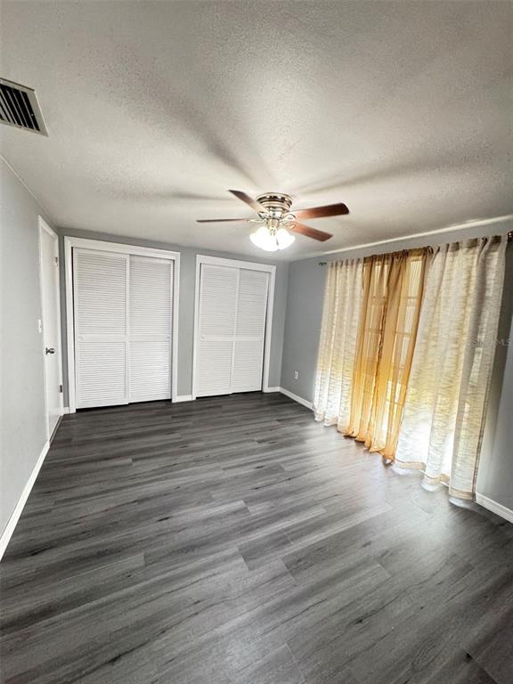 4025 Grayton Drive New Port Richey, FL 34652 - Photo 13 of 33 wooden floor in an empty room with a window