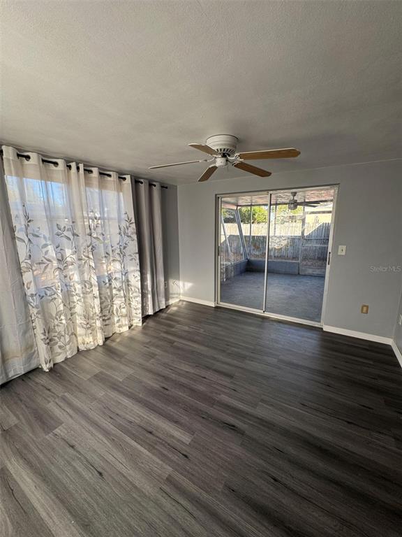 4025 Grayton Drive New Port Richey, FL 34652 - Photo 20 of 33 wooden floor in an empty room with a window