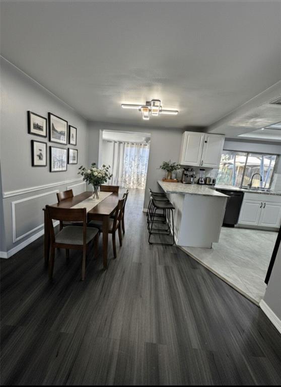 4025 Grayton Drive New Port Richey, FL 34652 - Photo 6 of 33 a view of a dining room with furniture and wooden floor