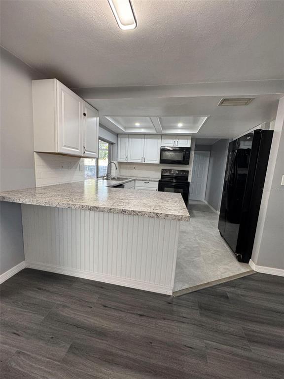 4025 Grayton Drive New Port Richey, FL 34652 - Photo 7 of 33 a view of kitchen with stainless steel appliances granite countertop a stove a refrigerator a sink and a oven