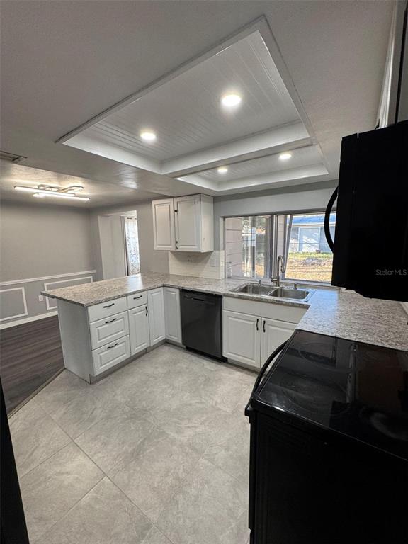 4025 Grayton Drive New Port Richey, FL 34652 - Photo 9 of 33 a large kitchen with stainless steel appliances a large counter top a stove and a refrigerator