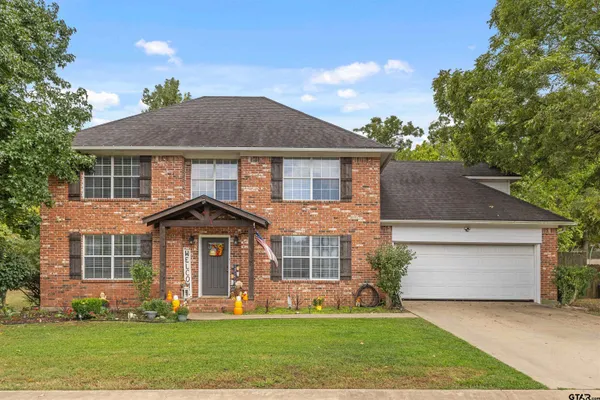 front view of a house with a yard