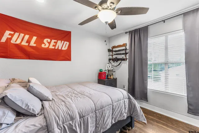 a bedroom with a bed and a window