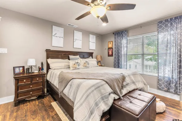 a bedroom with a bed and a window