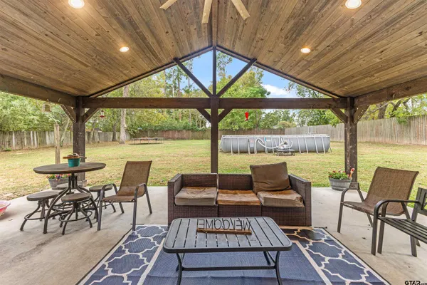 a view of a patio with a table chairs and a patio