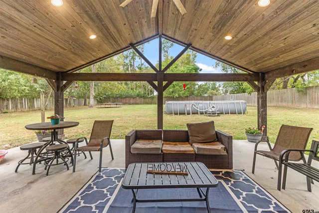 a view of a patio with a table chairs and a patio