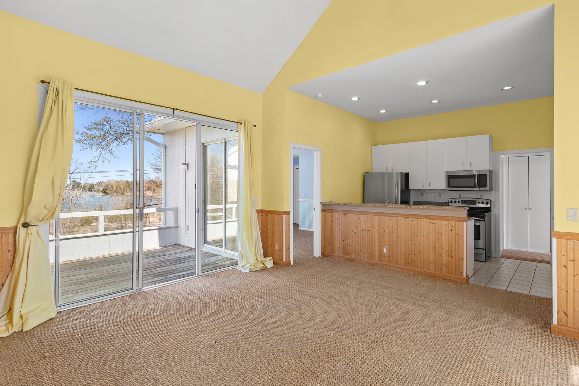 400 Noyack Road, Unit B6 Southampton, NY 11968 - Photo 4 of 12 a large kitchen with a large counter top appliances and cabinets