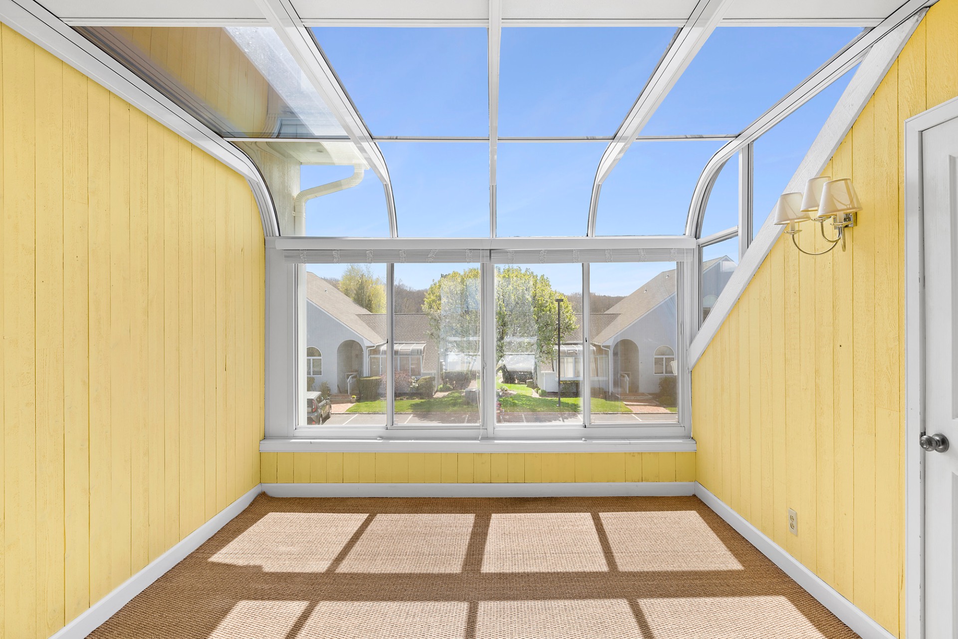 400 Noyack Road, Unit B6 Southampton, NY 11968 - Photo 7 of 12 a view of a room with large windows