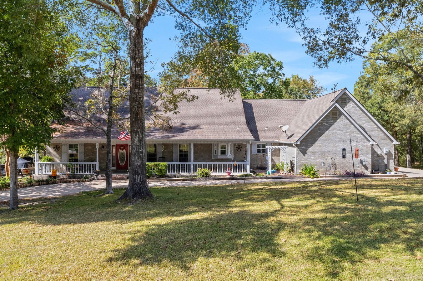 80 Lake Grove Drive Coldspring, TX 77331 - Photo 1 of 50 a house with swimming pool in front of it