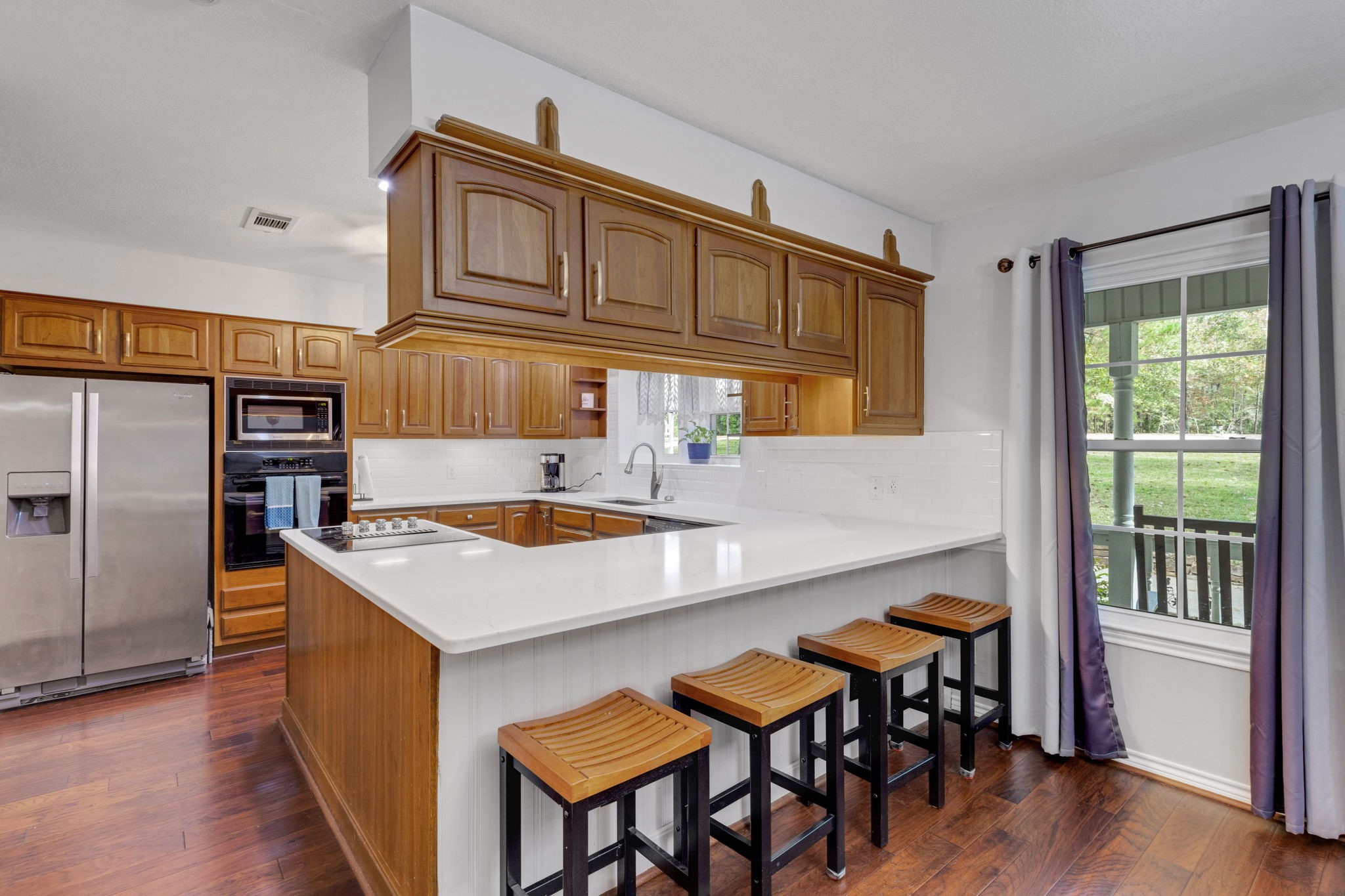 80 Lake Grove Drive Coldspring, TX 77331 - Photo 12 of 50 a kitchen that has a table and chairs in it