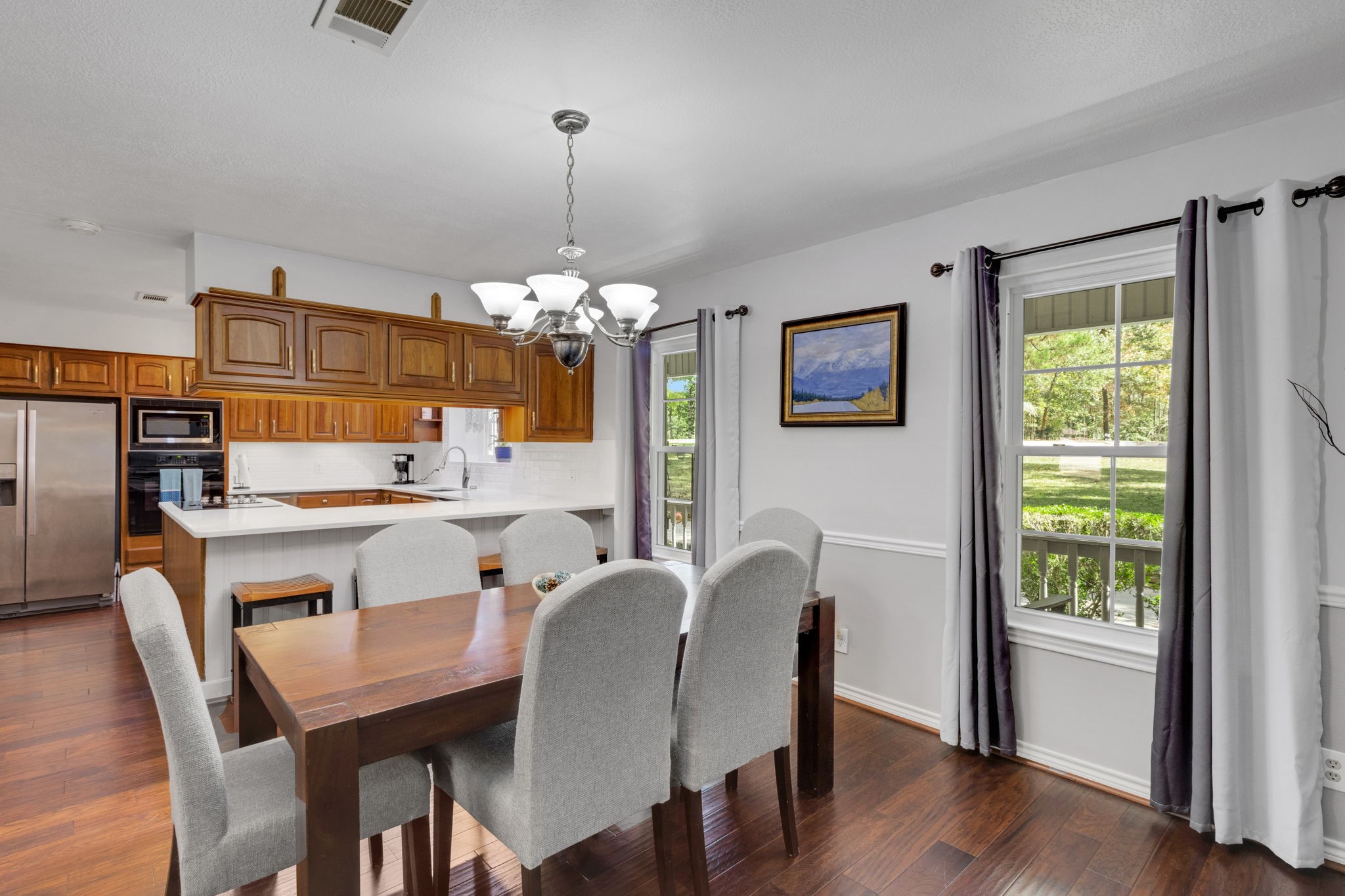 80 Lake Grove Drive Coldspring, TX 77331 - Photo 14 of 50 a view of a dining room with furniture window and wooden floor