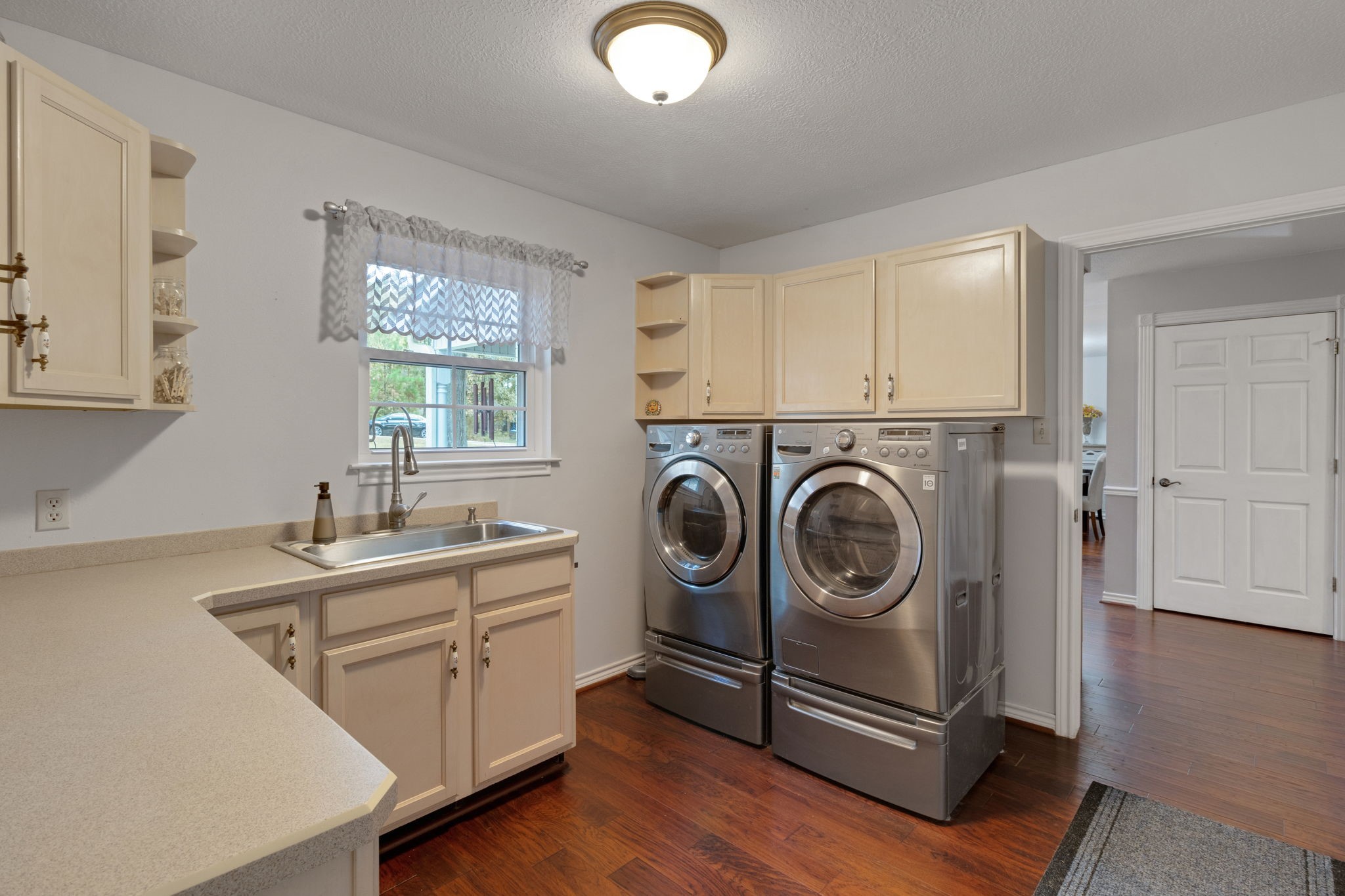 80 Lake Grove Drive Coldspring, TX 77331 - Photo 17 of 50 a utility room with sink dryer and washer