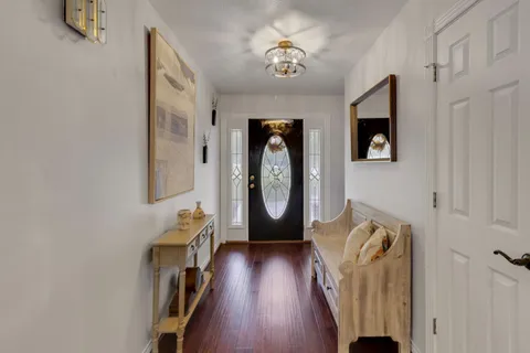 a view of entryway with wooden floor