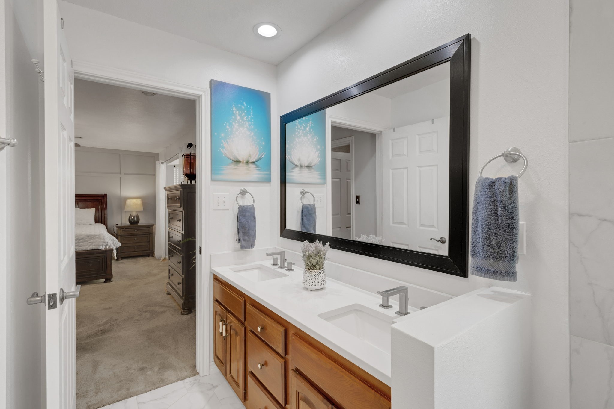 80 Lake Grove Drive Coldspring, TX 77331 - Photo 22 of 50 a spacious bathroom with a double vanity sink and a mirror