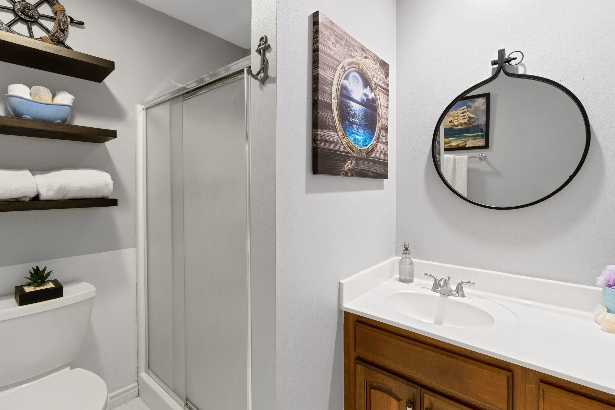 80 Lake Grove Drive Coldspring, TX 77331 - Photo 28 of 50 a bathroom with a toilet a sink and a mirror