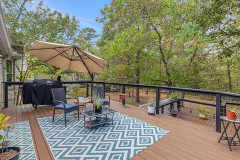 swimming pool view with a seating space