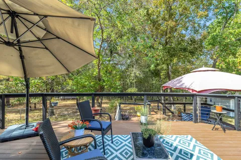 an outdoor space with furniture and umbrella