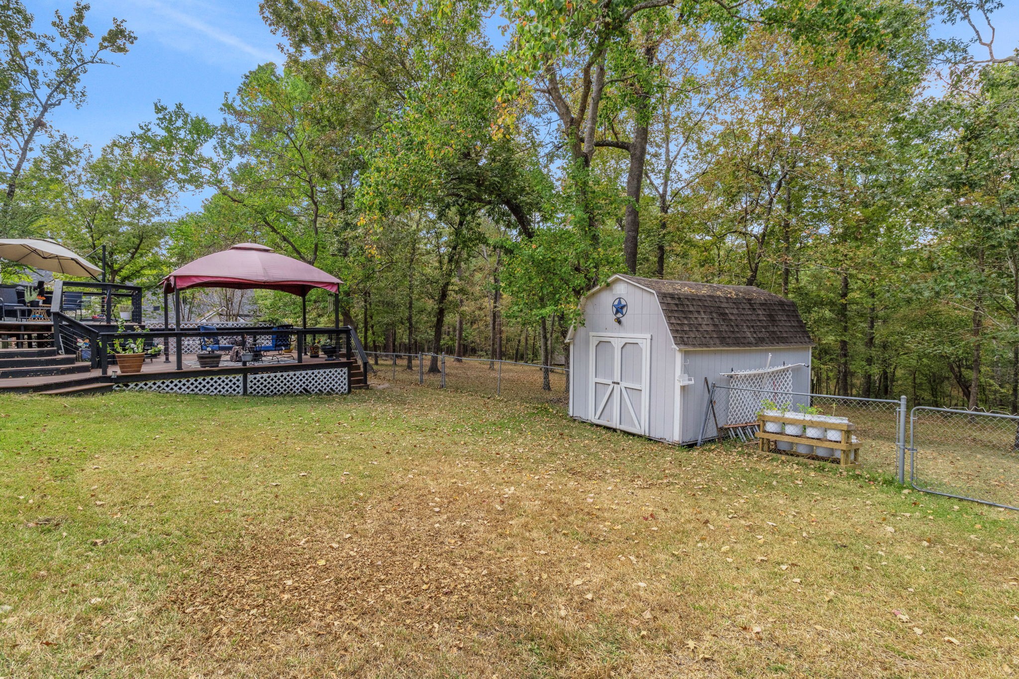 80 Lake Grove Drive Coldspring, TX 77331 - Photo 38 of 50 a view of a house with a yard and sitting area