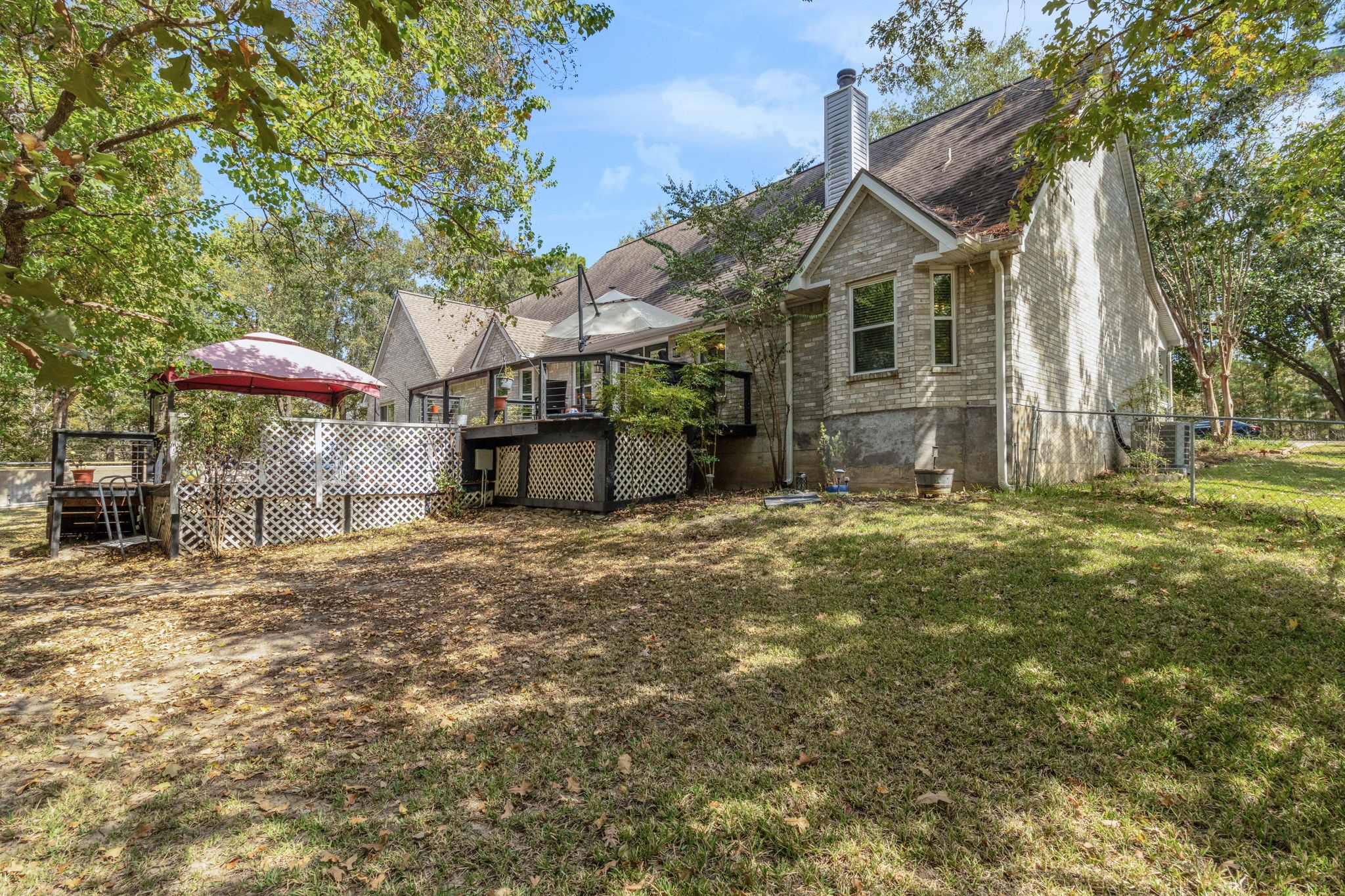 80 Lake Grove Drive Coldspring, TX 77331 - Photo 40 of 50 a view of a house with a yard
