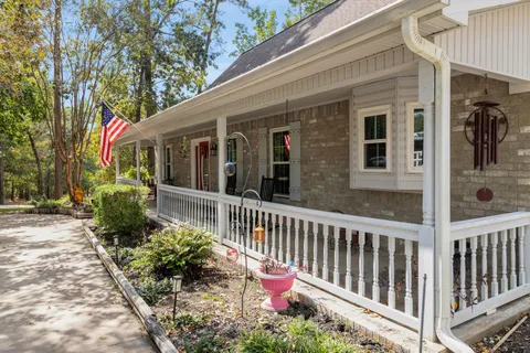 a view of a porch with wooden floor and outdoor space