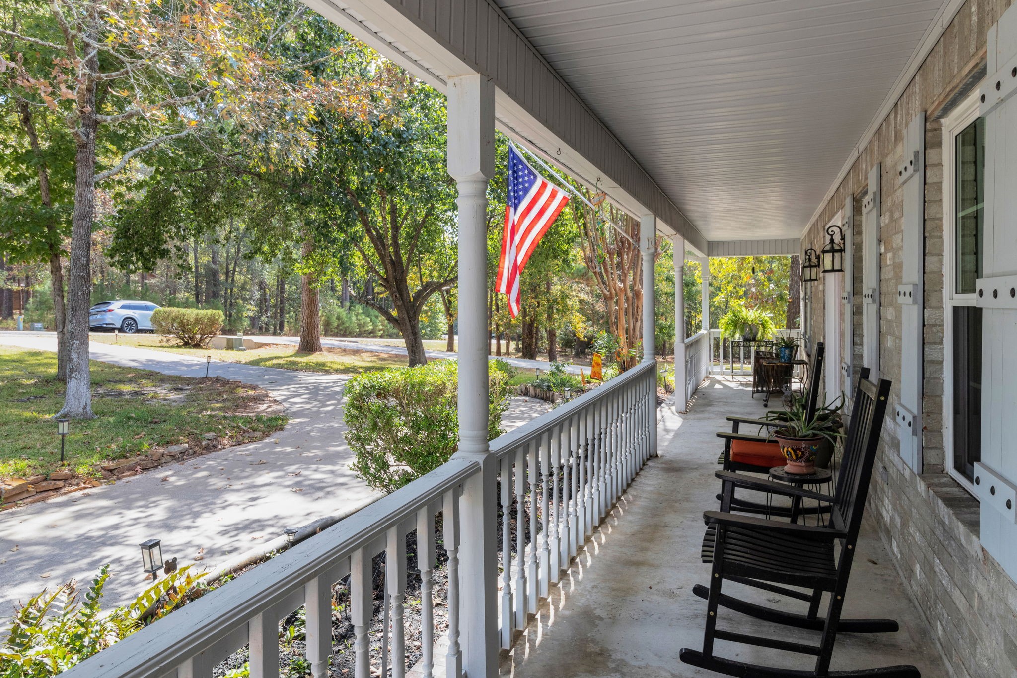 80 Lake Grove Drive Coldspring, TX 77331 - Photo 43 of 50 a view of a porch with wooden floor and outdoor space