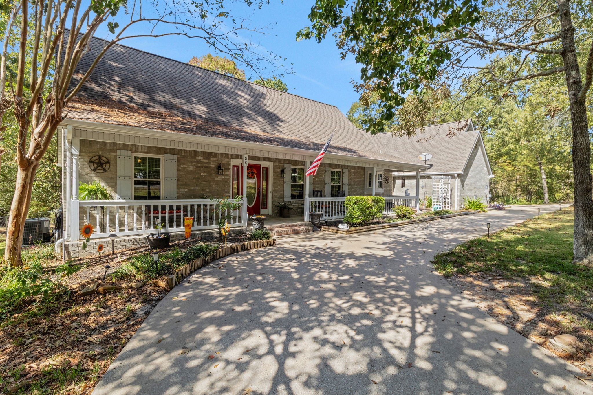 80 Lake Grove Drive Coldspring, TX 77331 - Photo 46 of 50 a view of a house with backyard and a tree
