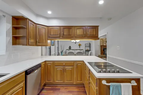 a kitchen that has a sink and a stove