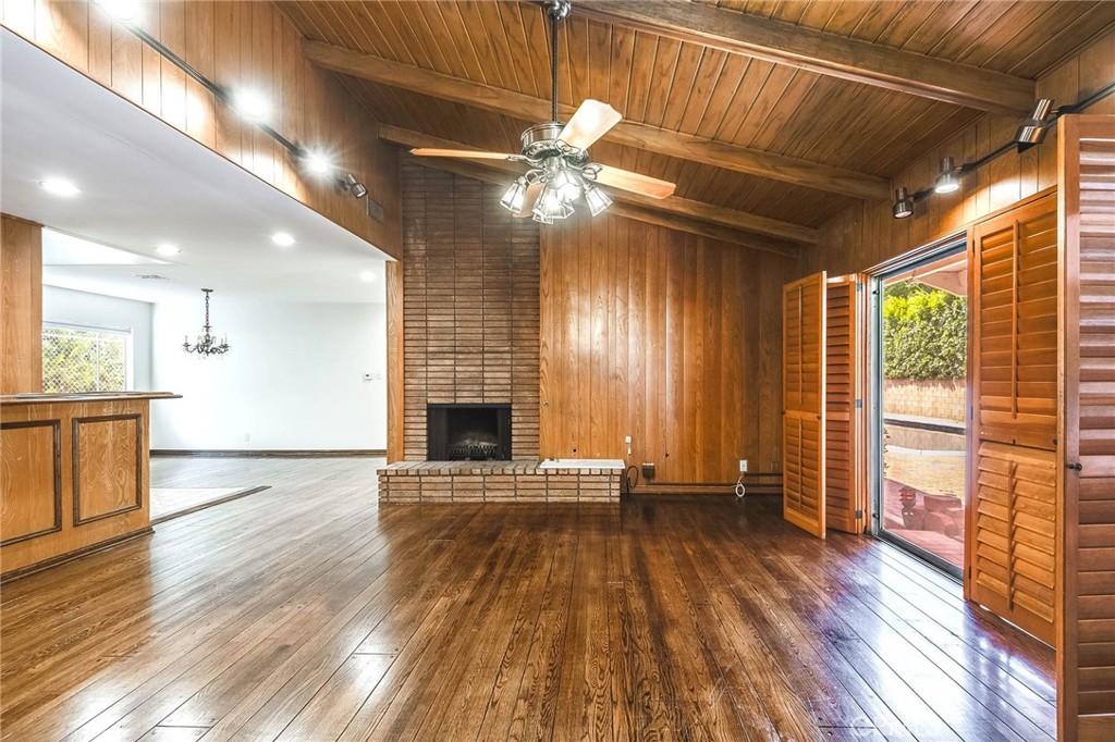 16258 Bertella Drive Encino, CA 91436 - Photo 12 of 45 a view of an empty room with wooden floor and a window