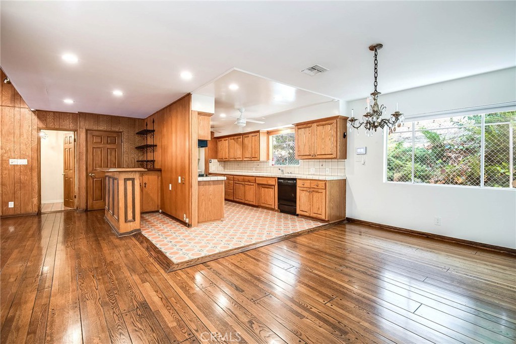 16258 Bertella Drive Encino, CA 91436 - Photo 15 of 45 a open kitchen with stainless steel appliances granite countertop a refrigerator a stove and a wooden floors