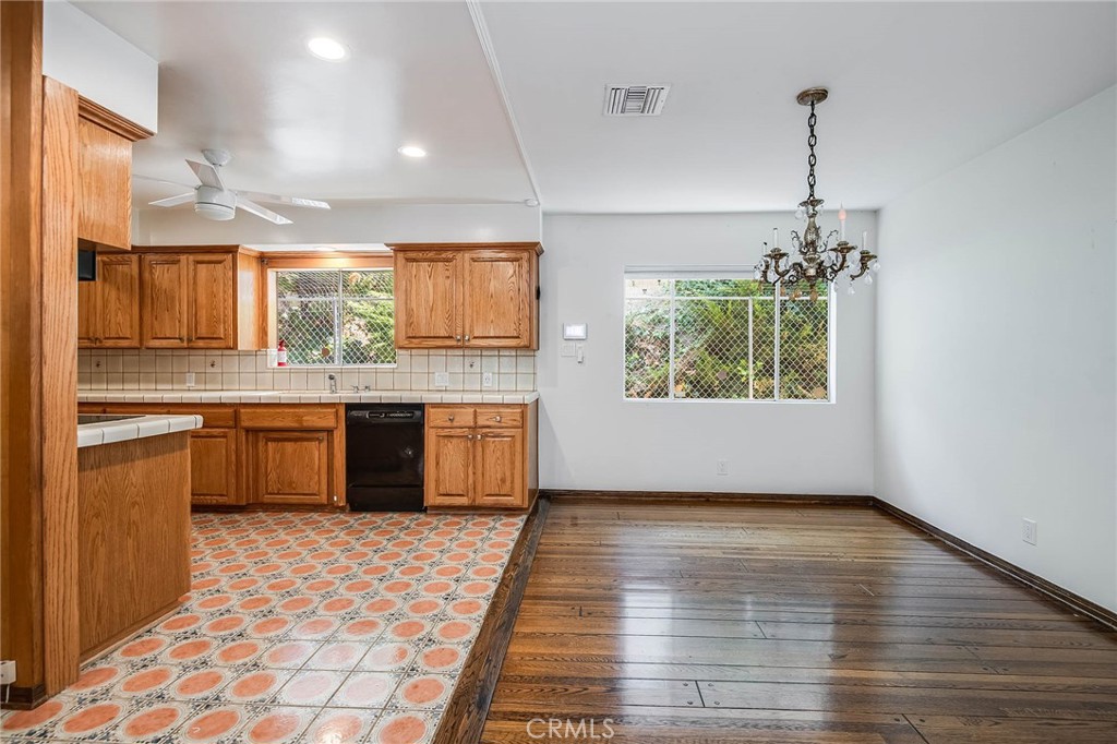 16258 Bertella Drive Encino, CA 91436 - Photo 16 of 45 a kitchen with stainless steel appliances granite countertop a stove a sink dishwasher and a refrigerator