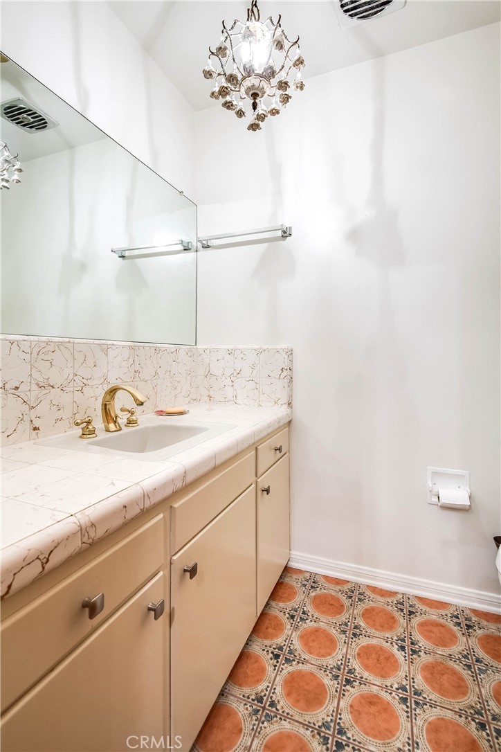 16258 Bertella Drive Encino, CA 91436 - Photo 20 of 45 a bathroom with a sink and a mirror