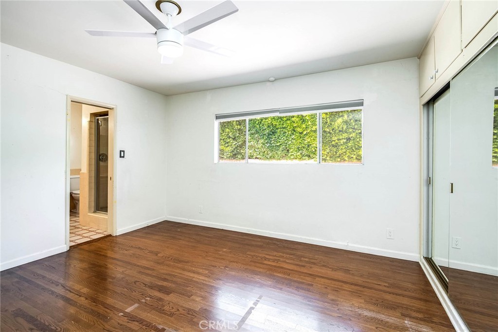 16258 Bertella Drive Encino, CA 91436 - Photo 24 of 45 wooden floor in an empty room with a window