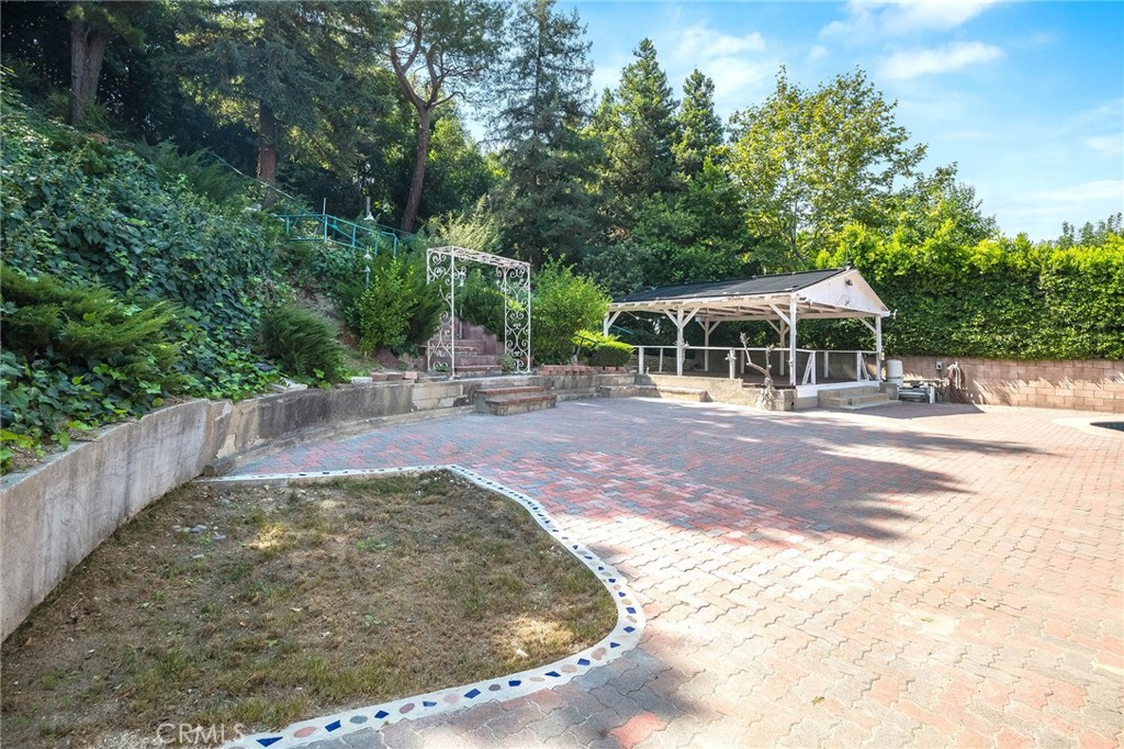 16258 Bertella Drive Encino, CA 91436 - Photo 36 of 45 a view of a swimming pool with a patio