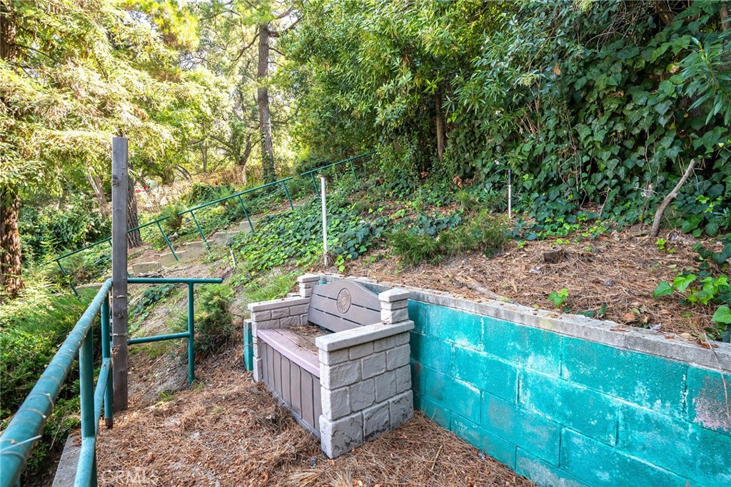 16258 Bertella Drive Encino, CA 91436 - Photo 39 of 45 a view of a chairs and table in the backyard