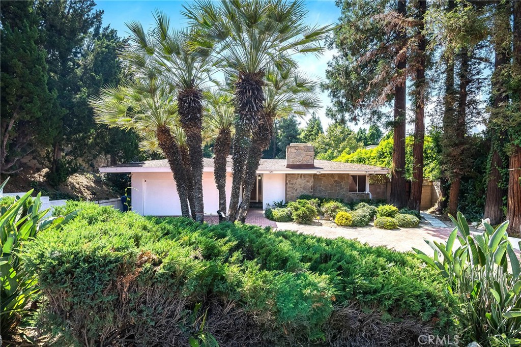 16258 Bertella Drive Encino, CA 91436 - Photo 4 of 45 front view of a house with a yard