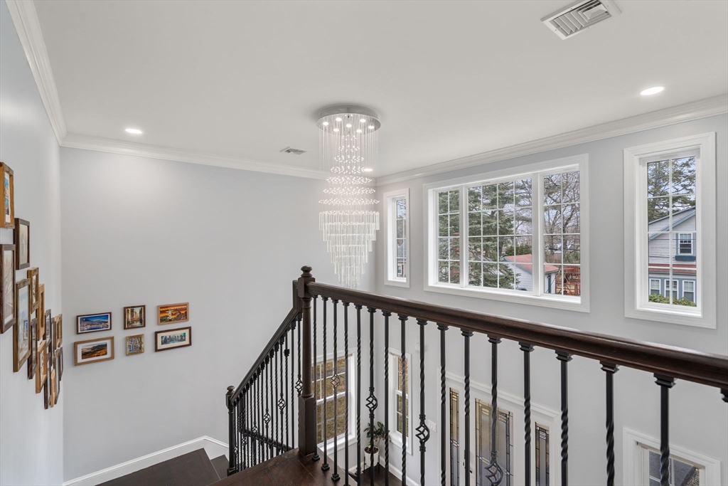 6 Ash Street Natick, MA 01760 - Photo 12 of 39 a view of a hallway with windows